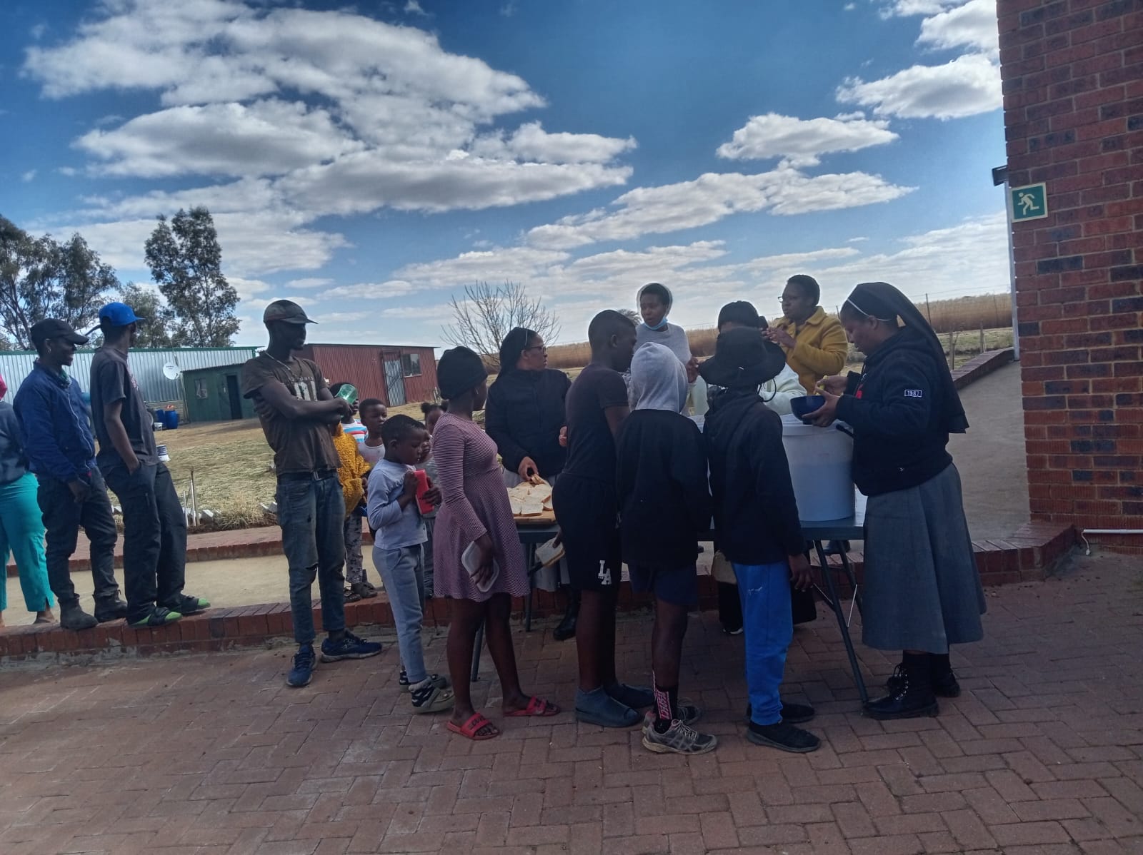 Sister providing warm meals to vulnerable individuals